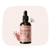 Bottle of 'Mighty Iron' liquid drops with a pink label on a light pink background